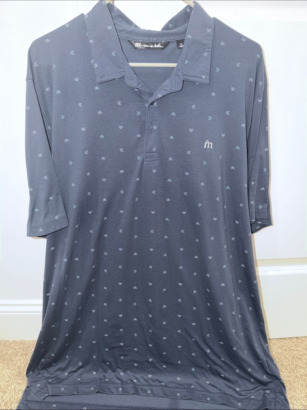 Travis Mathew navy Polo with Subtle Light Blue Micro Motif